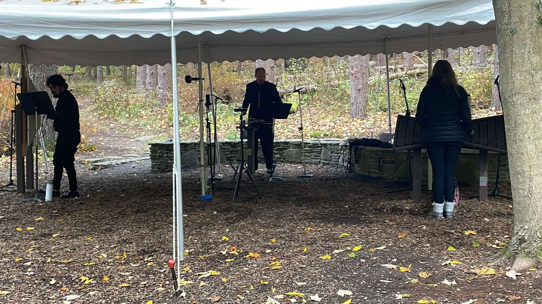 Ross, Matt and Melanie play under a tent at The Music Circle, on the second ANTiverary of the opening of The Trail.
